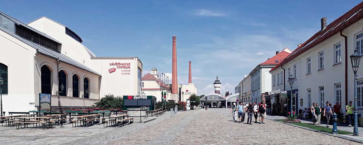 The premises of the Prazdroj Brewery with a water tower in the backdrop